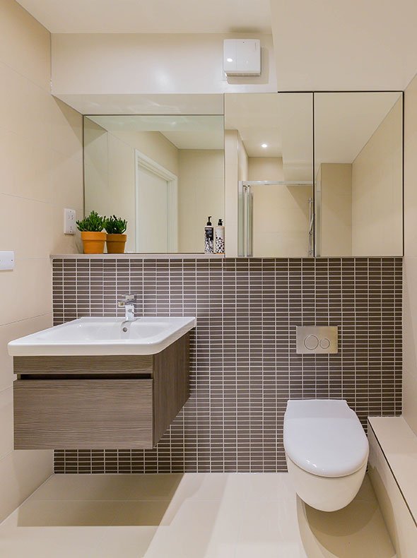 en-suite shower room interior by Element Studios with grestec Mattone dark brown mosaic tiles and bespoke mirrored wall units