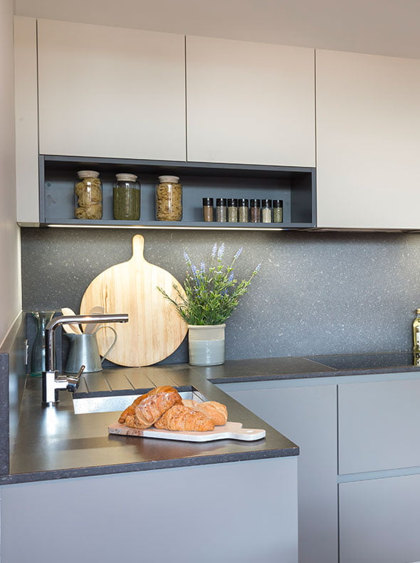 Fulham flat interior for Verve Properties close-up of German kitchen by Kochwerk with stone worktop and wooden chopping board