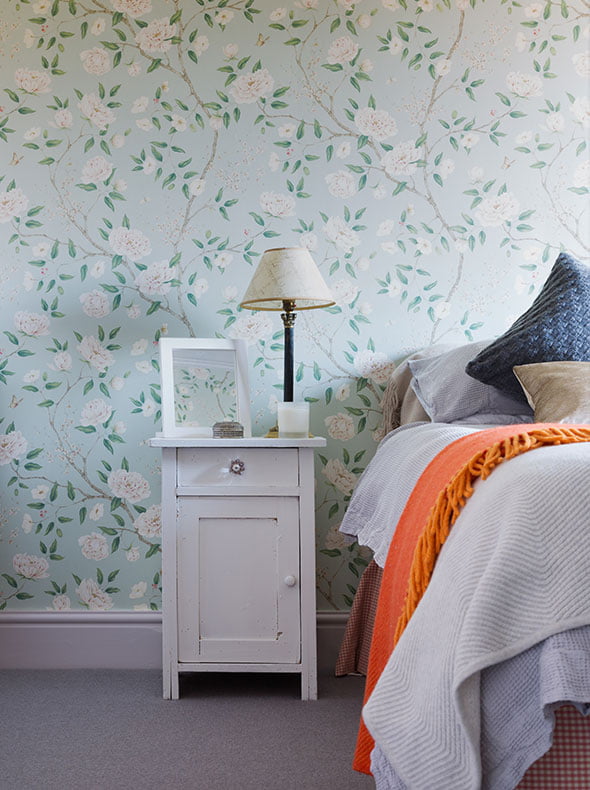 vintage bedside table in guest bedroom with Zoffany Romey’s Garden wallpaper on walls and Peignoir eggshell on woodwork