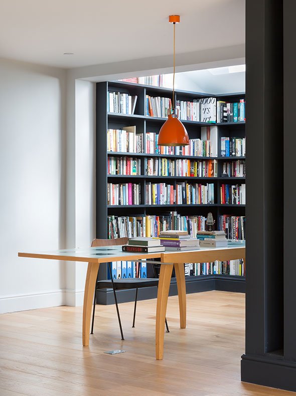 bespoke library designed by Element Studios and painted in Railings with mid-century desk and chair and orange Jielde pendant