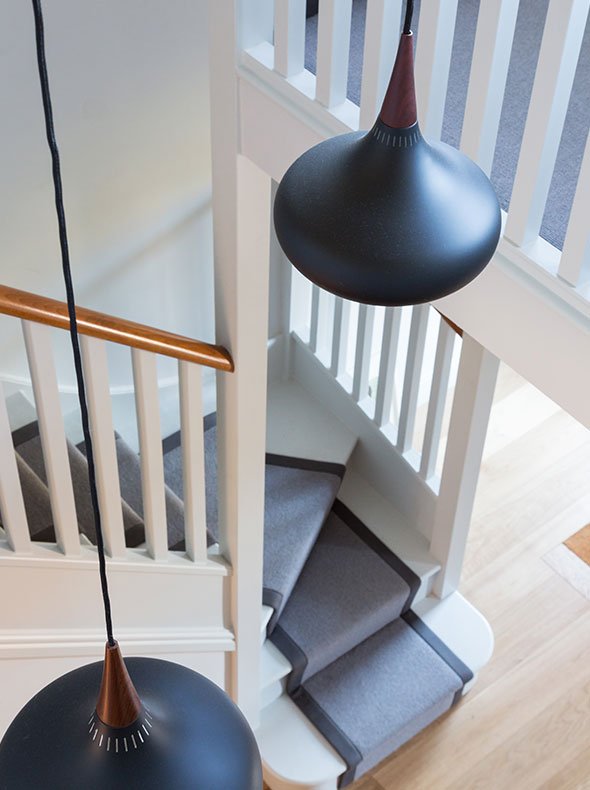 hallway and staircase of refurbished Oxford townhouse with grey carpet runner and Orient P3 pendants from SCP