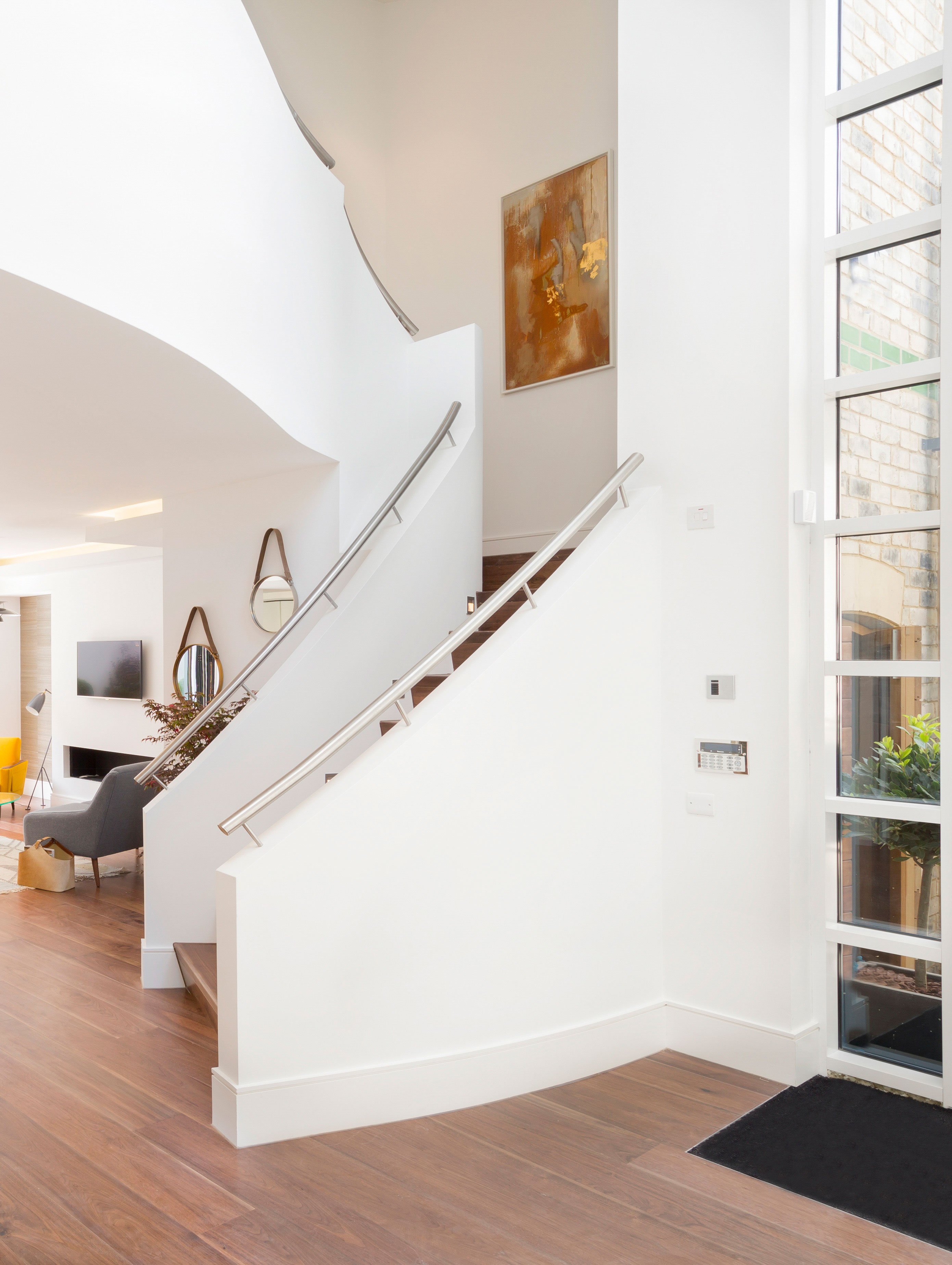 Interior Verve Properties Sunlight Mews staircase dark oak floorboards Gubi Grasshopper floor lamp