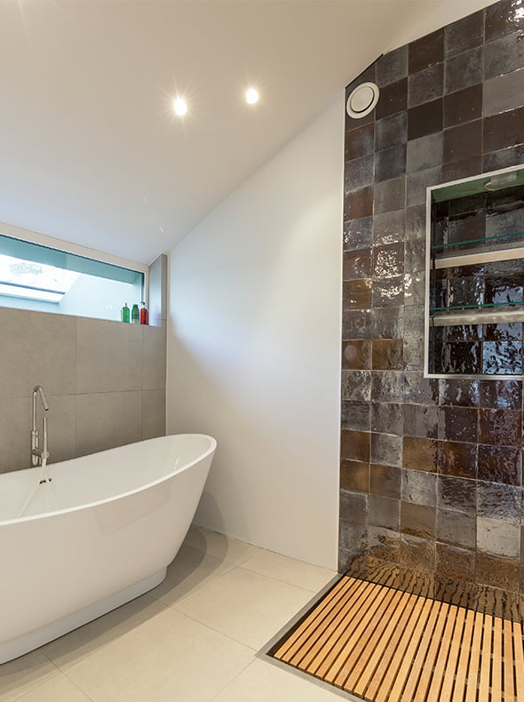 Verve Properties Fulham townhouse freestanding bath with glazed wall tiles and flush timber slatted shower tray