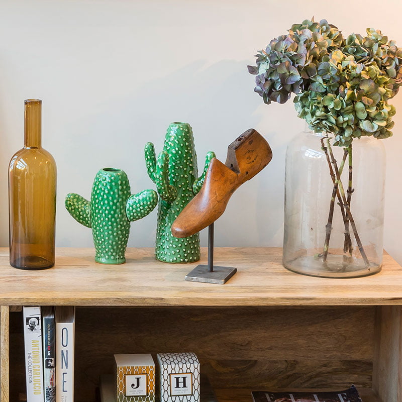 wooden shelf unit with Rockett St George green cactus vase and vintage hardwood shoe stretcher from The Old Cinema London