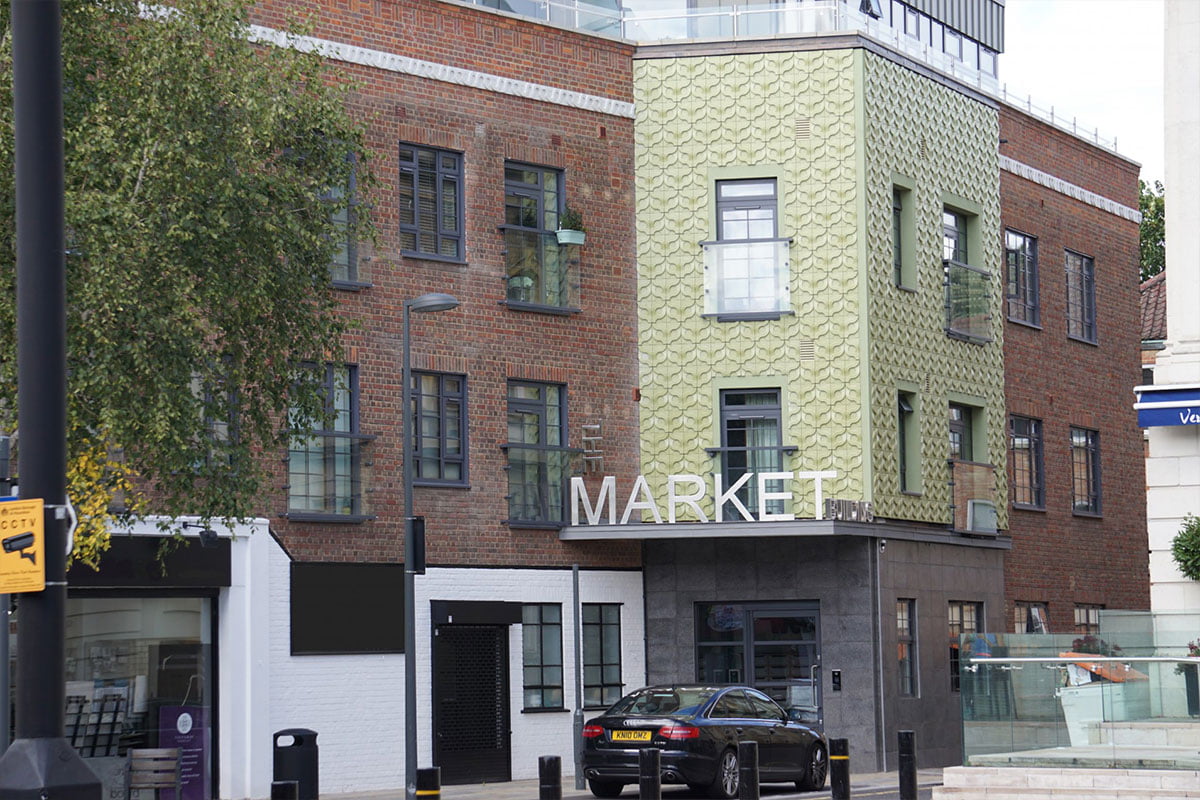 Old Market Building Brentford converted to flats with exterior 1950s style Kaza concrete tiles vine by Gillian Blease