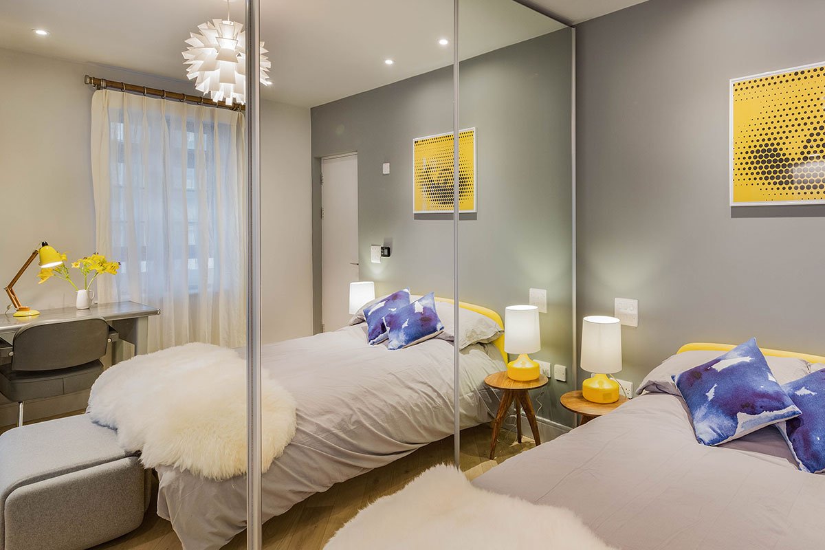 contemporary bedroom Normann Copehagen pendant 1950s vintage desk and chair Jonah dandelion double bed white sheepskin throw