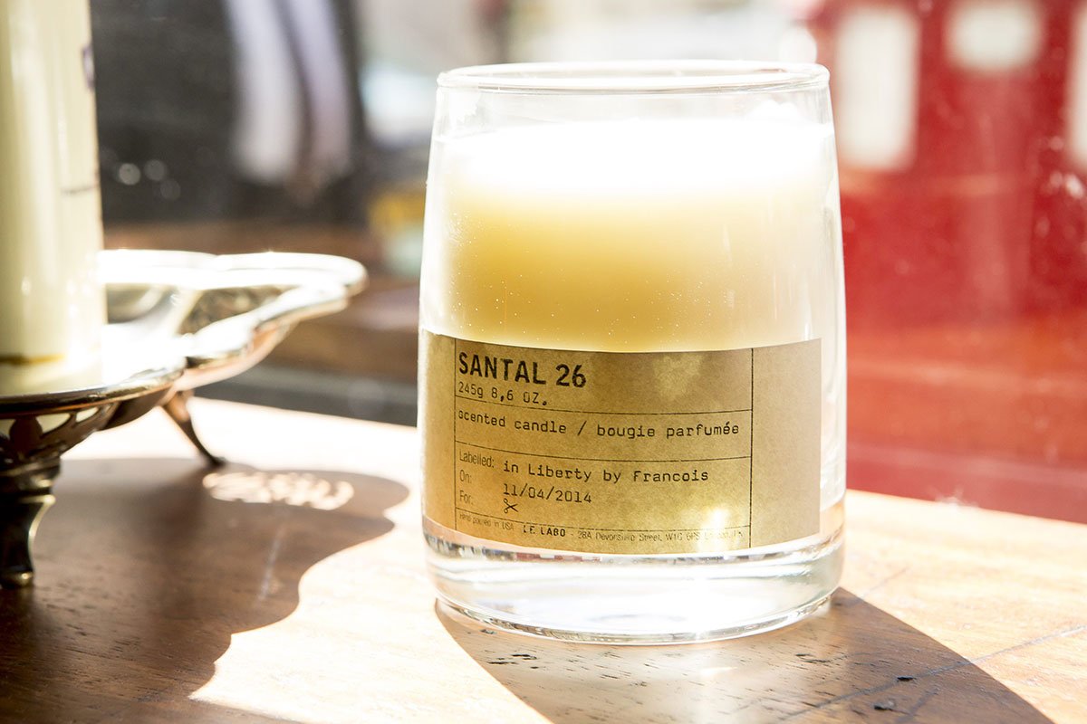 Liberty London Santal scented candle on reclaimed iroko school laboratory desk shelving from Retrouvious for George Northwood