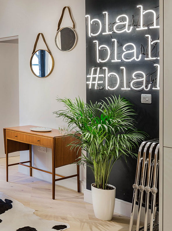 West London contemporary living dining room with vintage drop leaf table from Funky Junky and neon Heals Blah blah blah sign