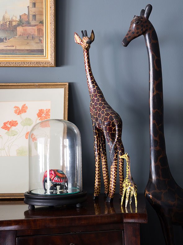 vintage dark wood sideboard with wooden animal ornaments and bell jar Farrow & Ball Downpipe emulsion