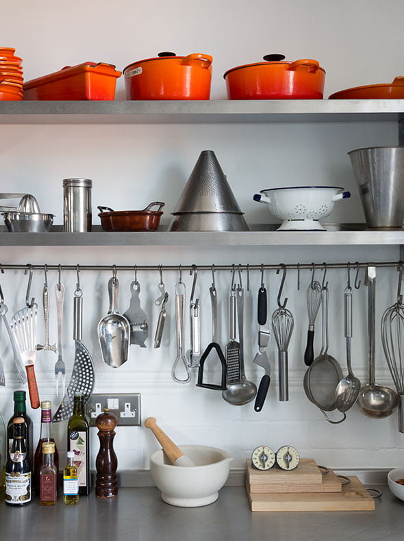 Industrial kitchen in East London with stainless steel worktop and Le Creuset pots by Element Studios interior design