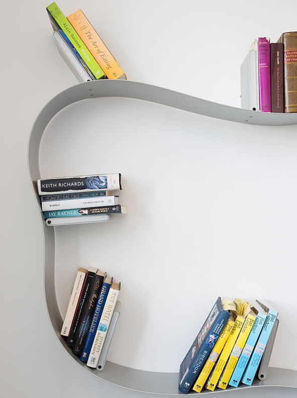interiors residential refurbishment in East London by Element Studios showing Ron Arad bookworm shelving from Kartell