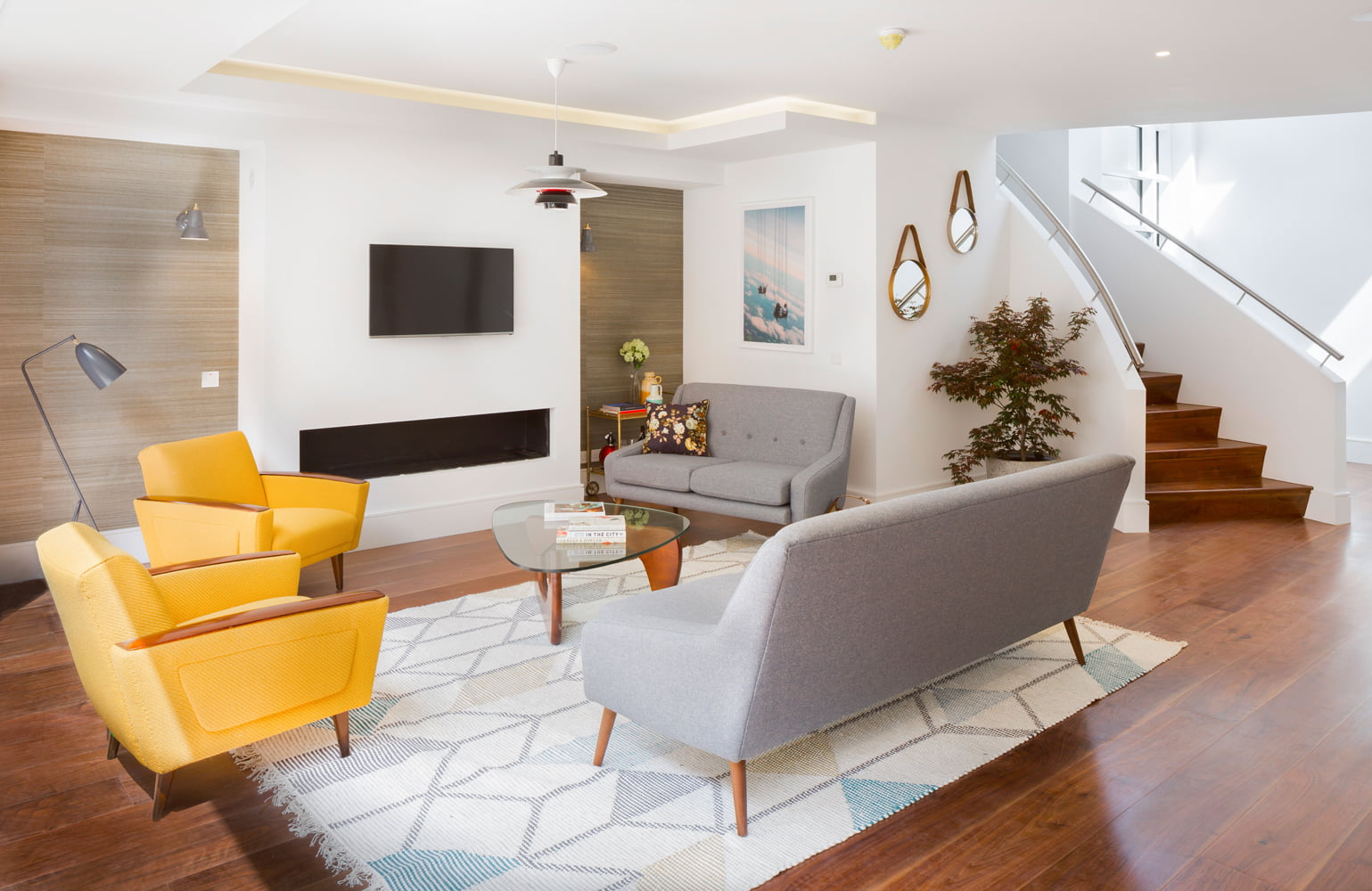 living room Louis Poulsen PH 50 pendant Phillip Jeffries wall covering floral cushion by Emily Chambers and Noguchi table